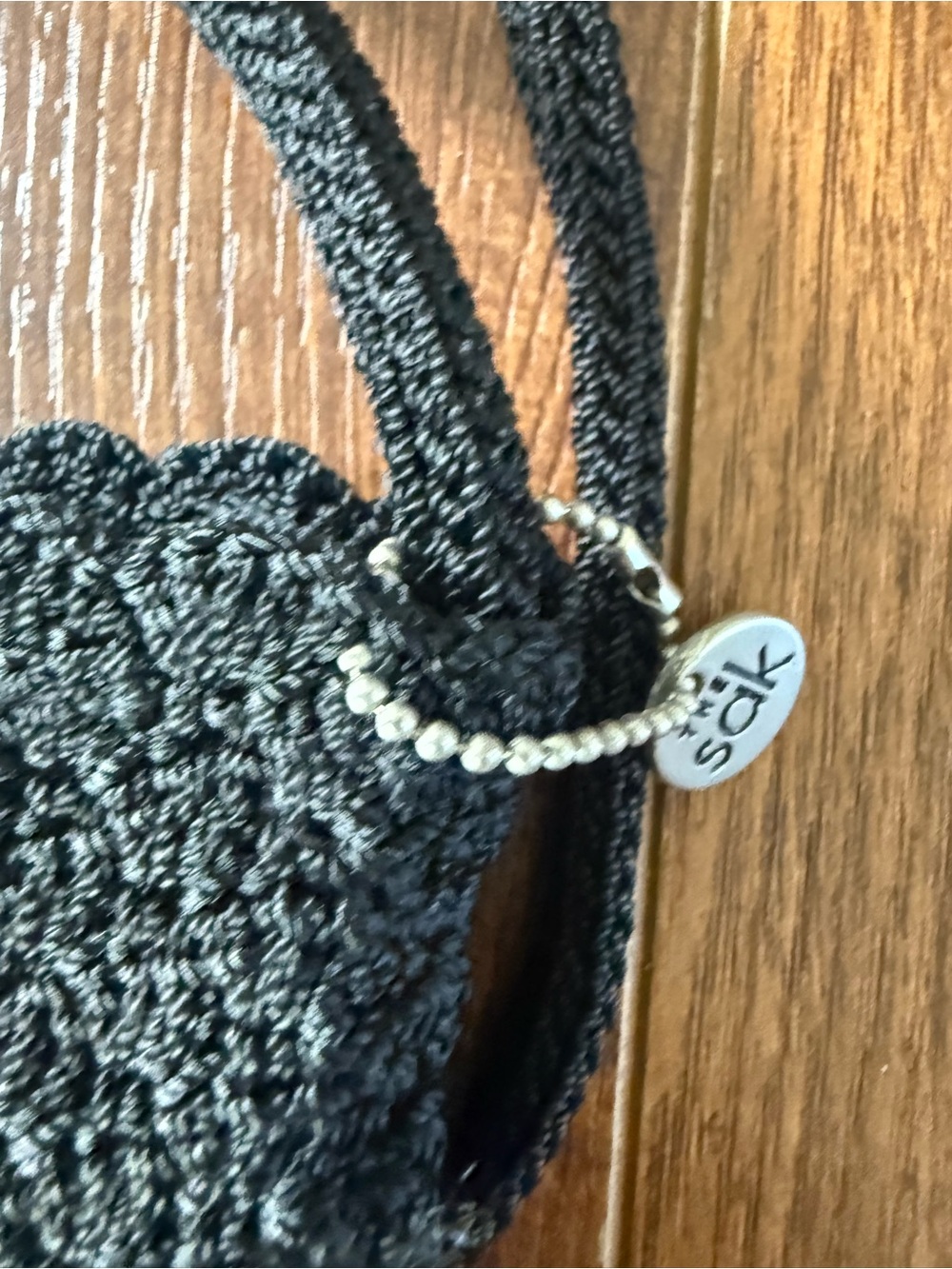 The Sak Black Crochet Crossbody with Silver Charm